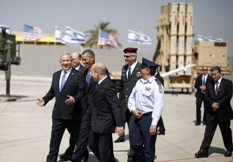 US President Barack Obama walks with Prime Minister Benjamin Netanyahu as he views an Iron Dome Defense Battery at Ben-Gurion International Airport, March 20, 2013.