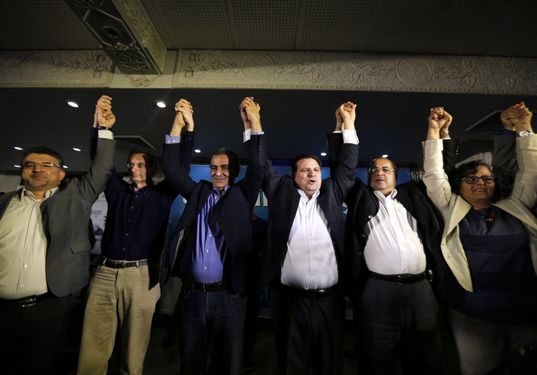 Ayman Odeh (3rd R), head of the Joint Arab List, reacts with members of the party after exit poll results in Nazareth March 17