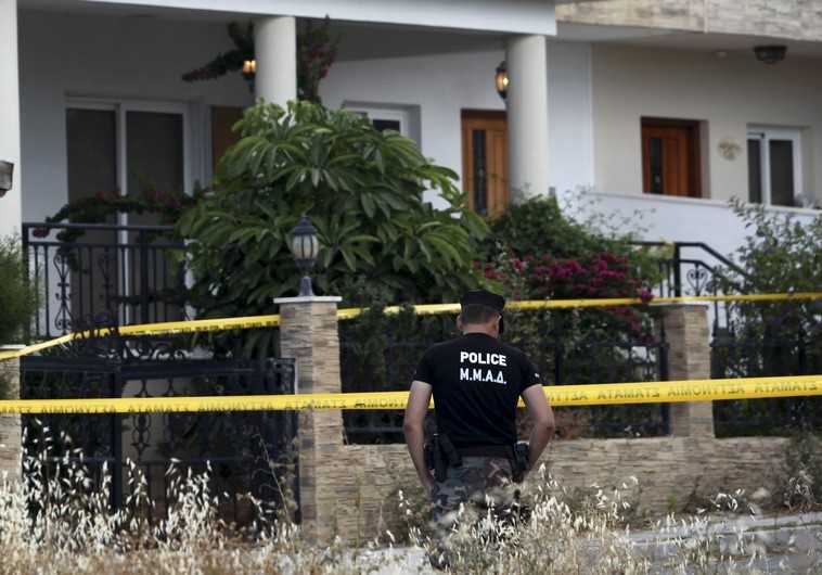 A policeman stands guard at a house where police discovered almost two tonnes of ammonium nitrate, in Larnaca, Cyprus, May 29