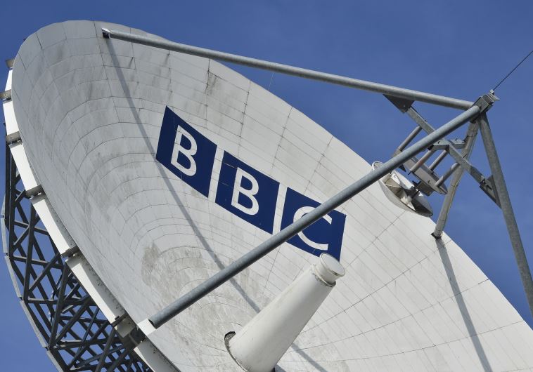 A satellite transmission dish is seen near BBC Television Center at White City in London