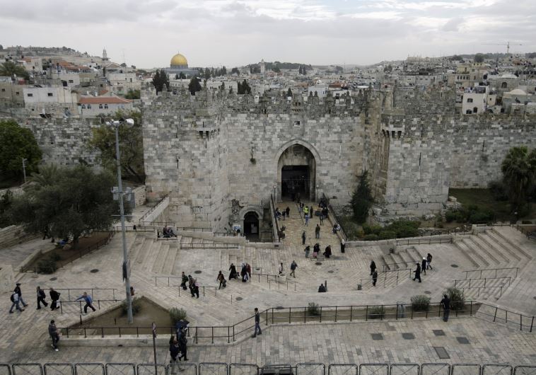 Passers-by walk near the Damascus Gate in Jerusalem's Old City [File[
