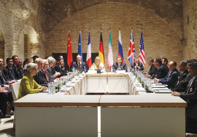 NEGOTIATORS FOR Iran and six world powers are shown meeting in the historic basement of the Palais Coburg Hotel in Vienna in April.