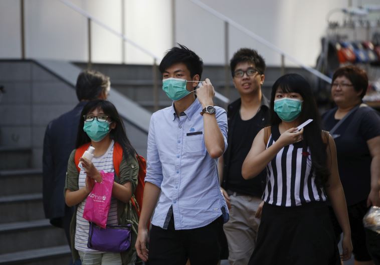 Tourists in Seoul, South Korea wear protective masks to prevent themselves from contracting Middle East Respiratory Syndrome (MERS)