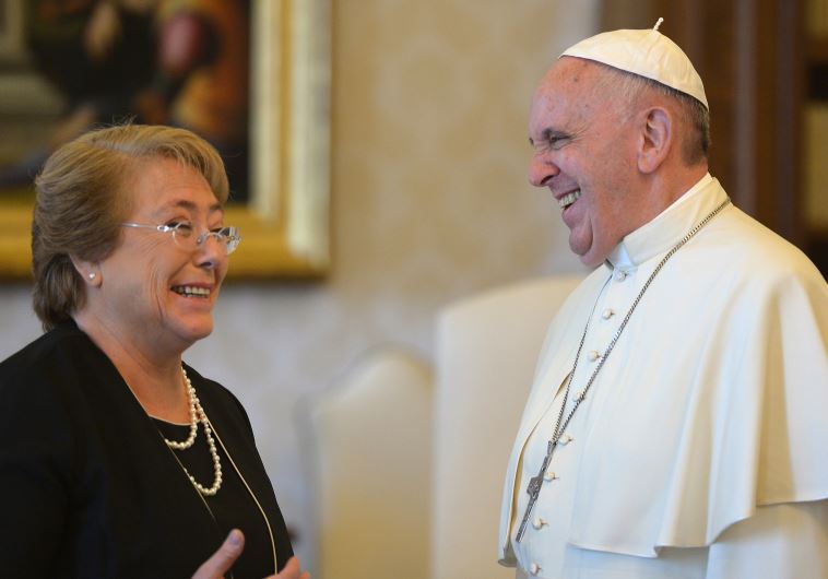 Pope Francis and Chile's President Michelle Bachelet laugh during a private audience at the Vatican