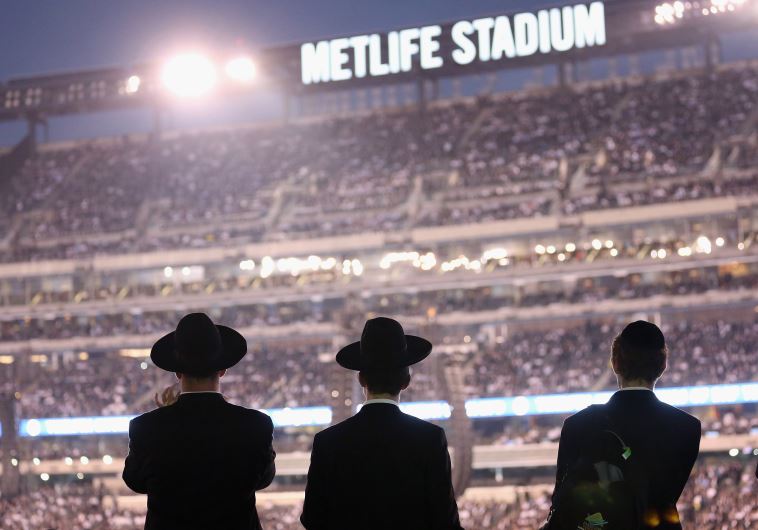 Orthodox Jews gather to celebrate the completion of study of the entire Talmud religious text in East Rutherford, New Jersey