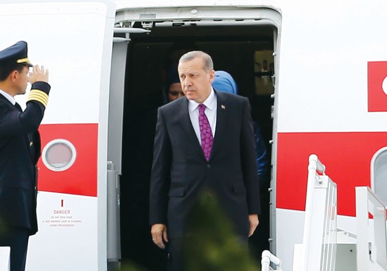 Turkish president Recep Tayyip Erdogan looks on after arriving in Ankara, on Tuesday.