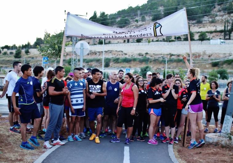 Members of Jerusalem’s Runners without Borders at an alternative race on June 11, 2015