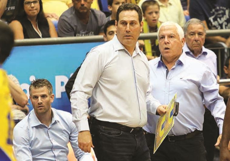 Despite having a guaranteed contract for next season, Guy Goodes (center) may have coached his final game for Maccabi Tel Aviv