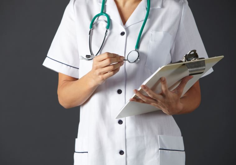 Nurse writing prescriptions (illustrative).