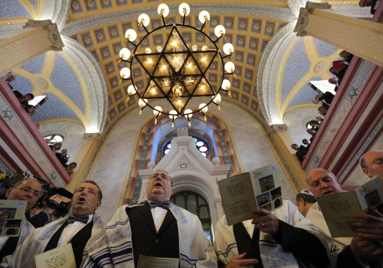 Jewish community members attend the re-opening ceremony of Great Synagogue in Edirne, western Turkey March 26, 2015.
