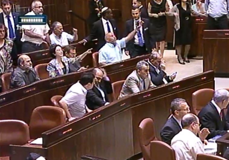 Israeli Knesset members arguing in parliament.