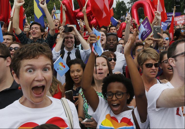 Gay rights supporters celebrate after the US Supreme Court ruled that the US Constitution provides same-sex couples the right to marry