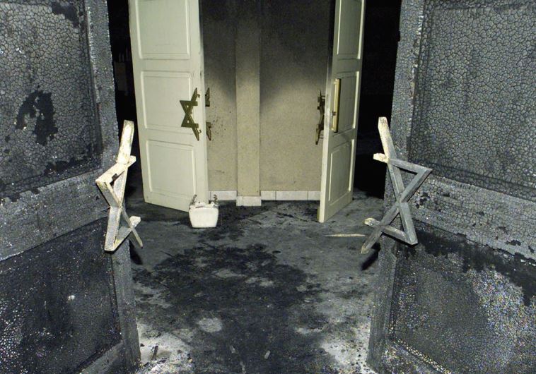 LYON’S WRECKED synagogue after vandals smashed cars into it and set it ablaze in 2002.