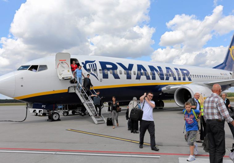 File photo of passangers leaving a Ryanair aircraft at Modlin airport near Warsaw, Poland June 26, 2014. 