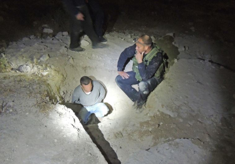 One of the suspects at the mouth of the cave‏.