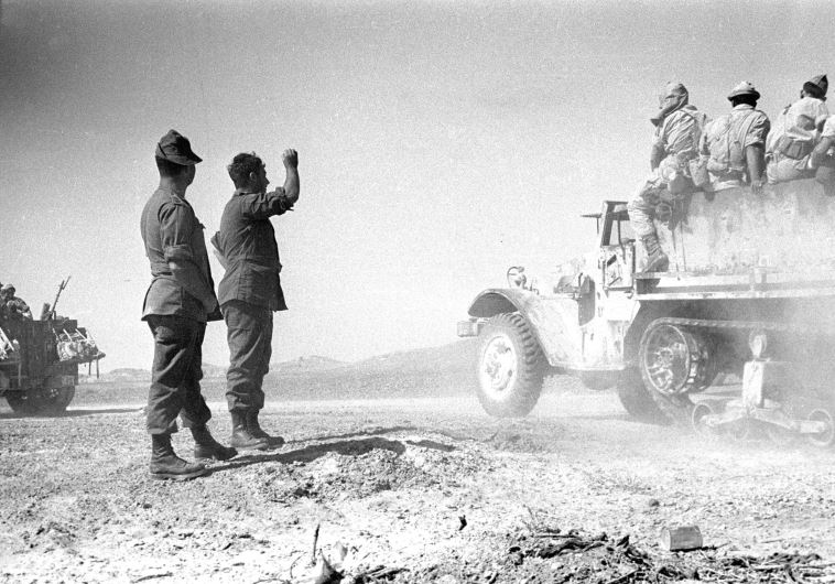 ISRAEL SOLDIERS on the way to the front line in Sinai in 1956.