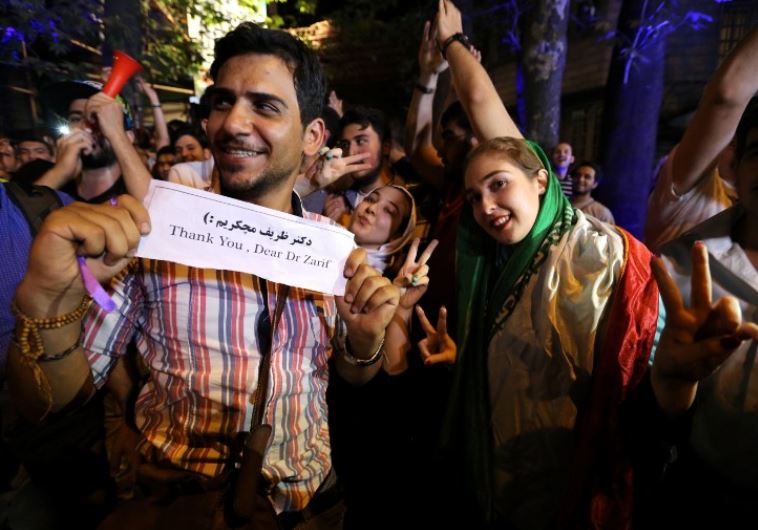 Iranians gather in celebration in northern Tehran on July 14, 2015, after Iran's nuclear negotiating team struck a deal with world powers in Vienna. Iranians poured onto the streets of Tehran after the Ramadan fast ended at sundown Tuesday to celebrate the historic nuclear deal agreed earlier with w