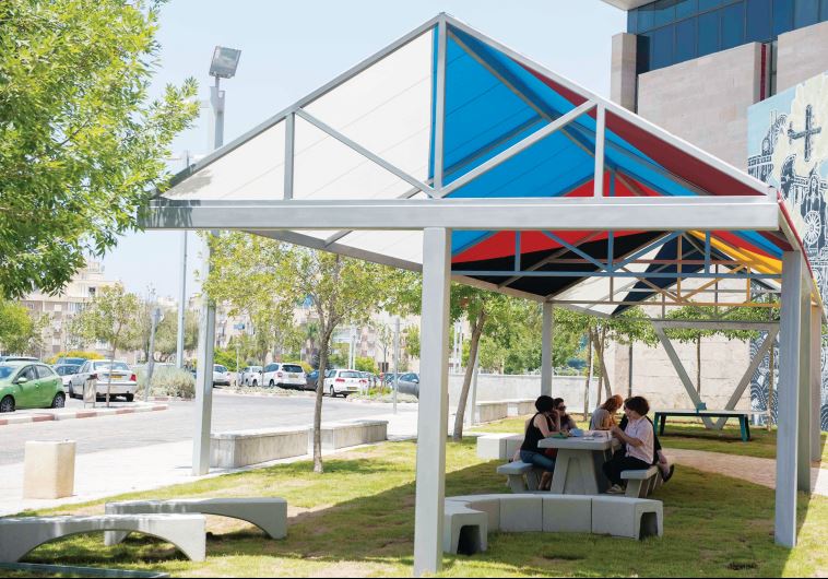 Outdoor shade installation, with cooling cover provided by a new form of acrylic fiber.