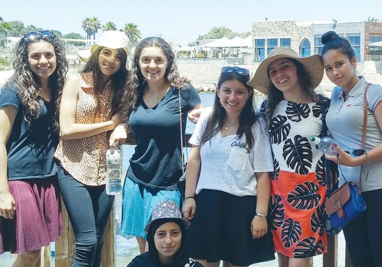 A group of teenage girls, in which half are American Jews and half are Israeli- Arabs from the Galilee, gather for a picture in Caesarea two weeks ago. 