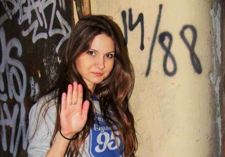 Olga Kuzkova was photographed posing in front of graffiti reading “14/88,” a coded message among white supremacists