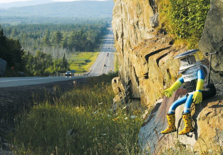 Hitchbot, the hitchhiking robot, on Highway 17 in Ontario, Canada.