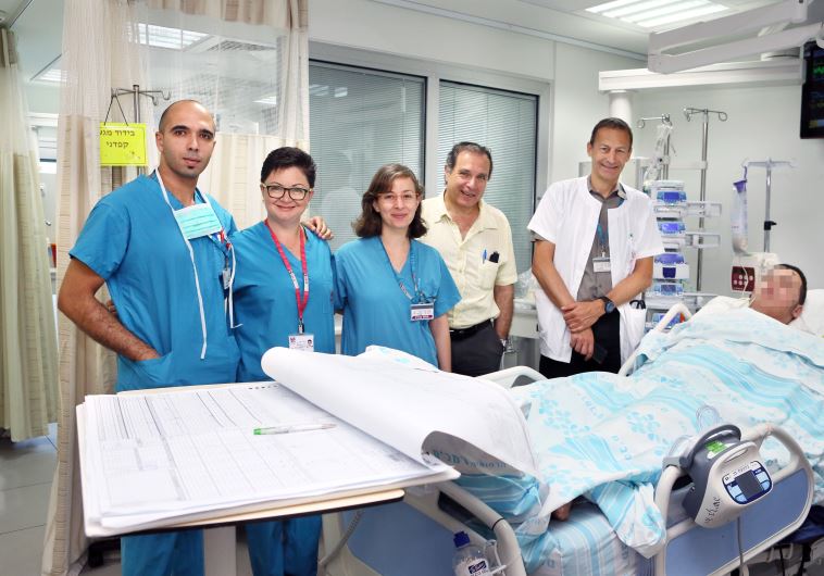 Prof. Bolotin (R) and team treating Palestinian team at Rambam Medical Center