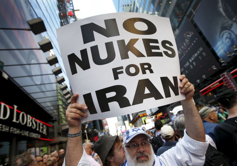 A man holds up a sign as he and several thousand other protestors demonstrate during a rally opposing the nuclear deal with Iran in Times Square