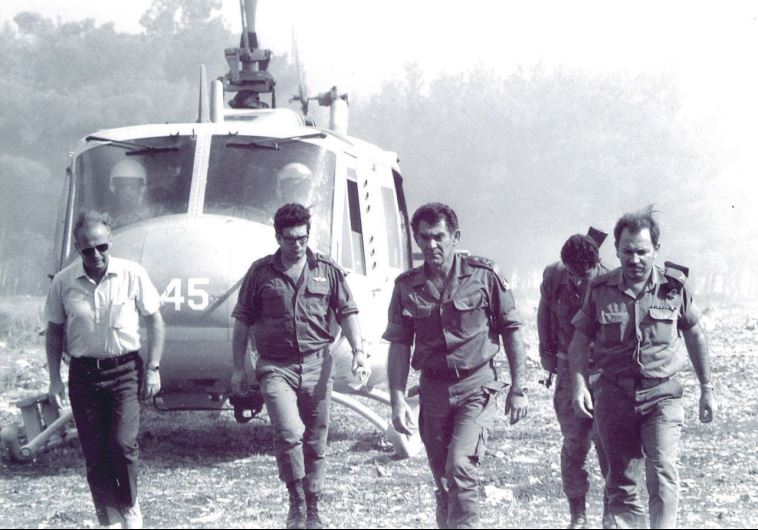 LT-Gen. David Elazar (center) alights from a helicopter to visit the troops on the Golan Heights. In the white shirt (left) is Yitzhak Rabin, serving as an informal advisor