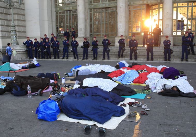 Migrants sleep outside the Keleti railway station in Budapest