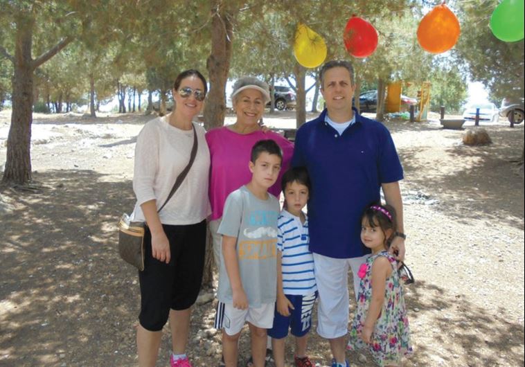 Leah Chase (center) stands with her family at her 77th birthday party in South Carolina’s Shoham Forest in May