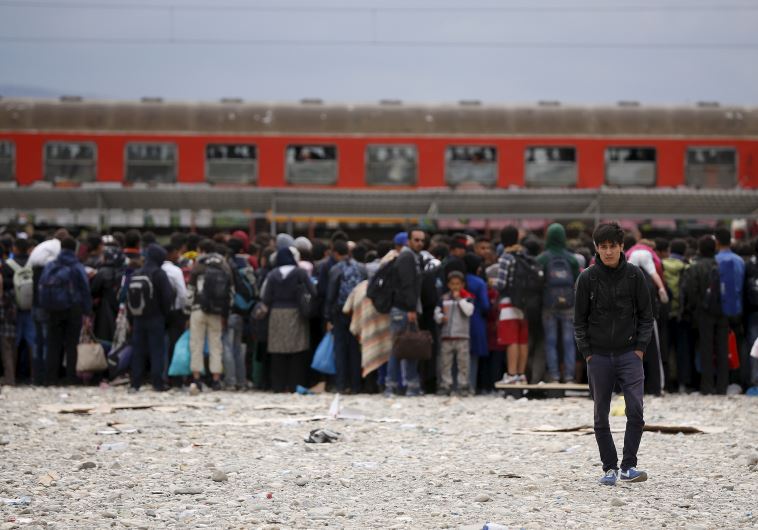 DATE IMPORTED: September 08, 2015 Migrants wait to board a train after crossing the Macedonian-Greek border near Gevgelija, Macedonia, September 8, 2015.