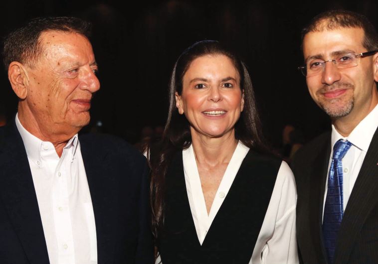Ofra Strauss poses with her father and US Ambassador Daniel Shapiro at the anniversary gala