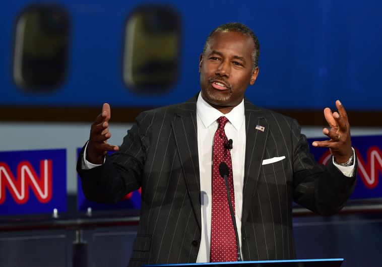 Republican presidential hopefuls, retired neurosurgeon Ben Carson gestures while speaking during the Republican presidential debate at the Ronald Reagan Presidential Library in Simi Valley, California on September 16, 2015. 