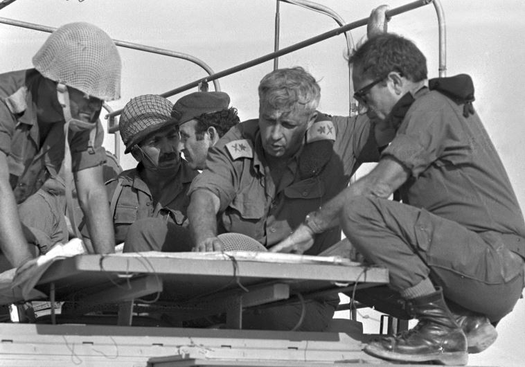 Ariel Sharon (2nd R) confers with comrades during the 1973 Yom Kippur War, October 10, 1973