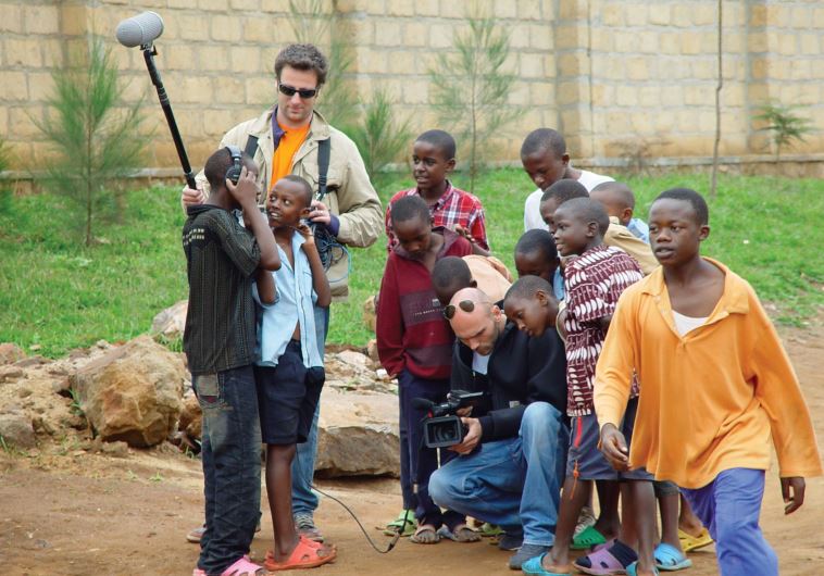 Ygal Egry (crouching) during filming in Kigali with sound engineer Frederic Cristea