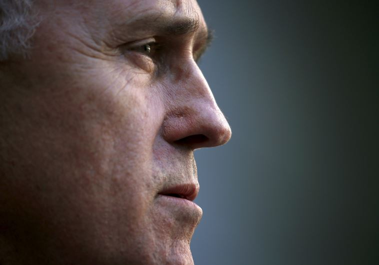 Australian Prime Minister Malcolm Turnbull listens to a question after announcing his new federal cabinet during a media conference in Canberra
