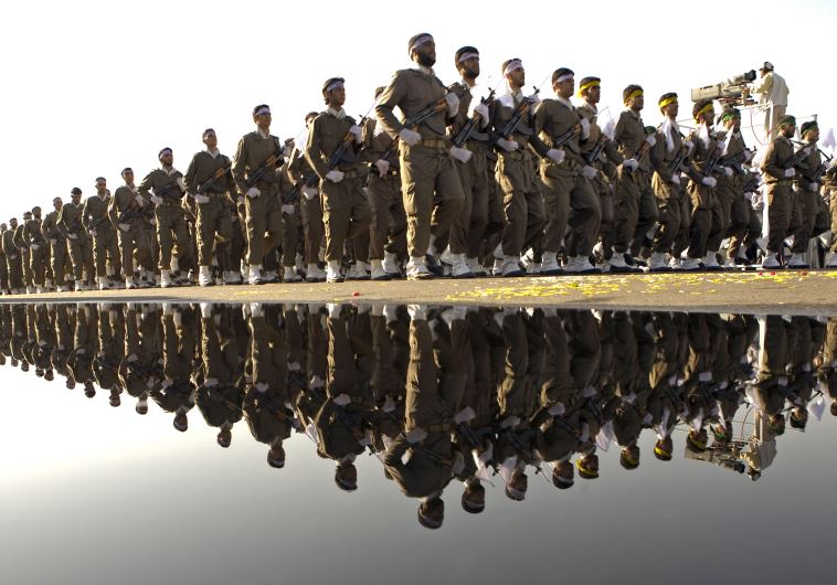 Members of Iran's Revolutionary Guards take part in a military parade to commemorate the 1980-88 Iran-Iraq war in Tehran