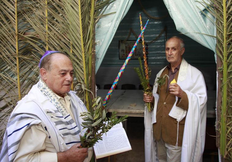 Moroccan Jews hold willows as they celebrate the festival of Succot in a synagogue in the old city of the capital Rabat