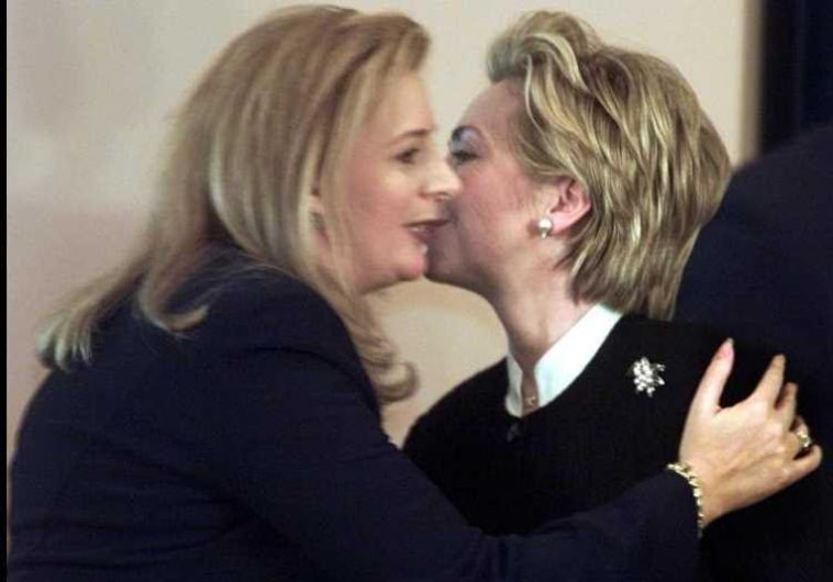 When Suha concluded, Hillary embraced her warmly and planted affectionate kisses on her cheek.  