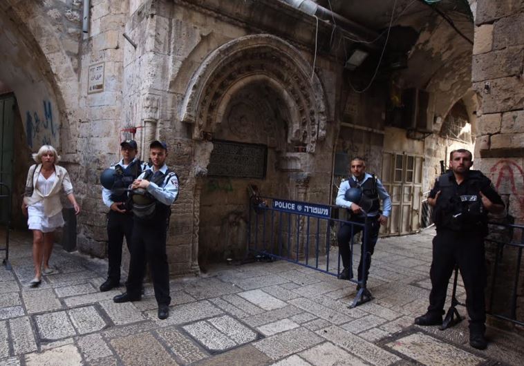 Police at a security barricade in the Old City of Jerusalem