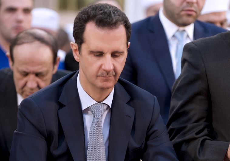 Syria's President Bashar Assad attends prayers on the first day of Eid al-Adha at al-Adel mosque in Damascus