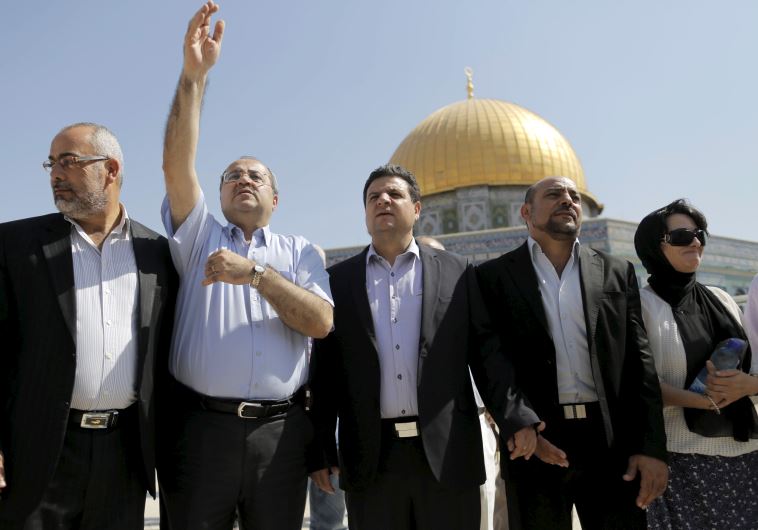 Israeli Arab lawmakers from the Joint List (from L to R) Osama Saadi, Ahmed Tibi, Ayman Odeh, Masud Ganaim and Haneen Zoabi stand in front of the Dome of the Rock