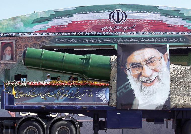 A MILITARY truck carrying a missile and a picture of Iran’s leader Ayatollah Ali Khamenei drives in a parade marking the anniversary of the Iran-Iraq war in Tehran