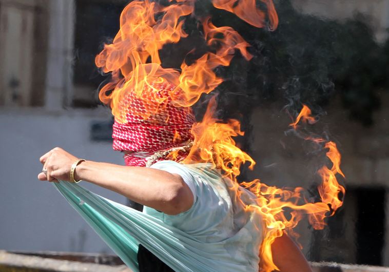 A Palestinian accidentally sets himself on fire after throwing a Molotov cocktail‏