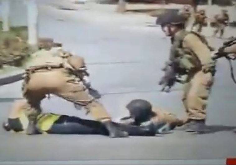 Hamas-run TV footage of attack in which a terrorist disguised as journalist stabs an IDF soldier near Kiryat Arba