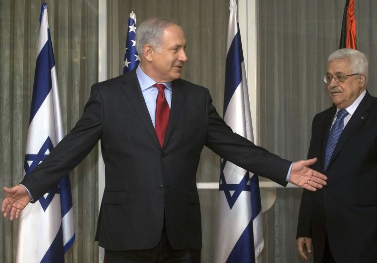 srael's Prime Minister Benjamin Netanyahu (L) gestures beside Palestinian President Mahmoud Abbas before their meeting in Jerusalem September 15, 2010