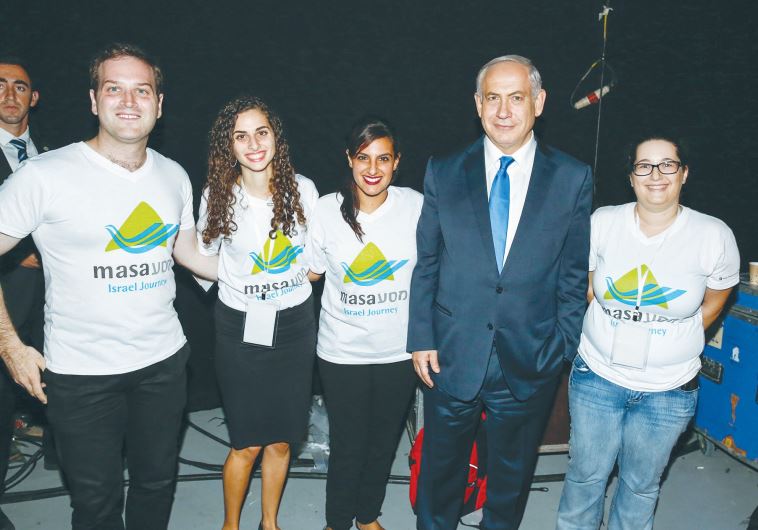 PRIME MINISTER Benjamin Netanyahu poses with participants in the MyMasa Event in Jerusalem last night.