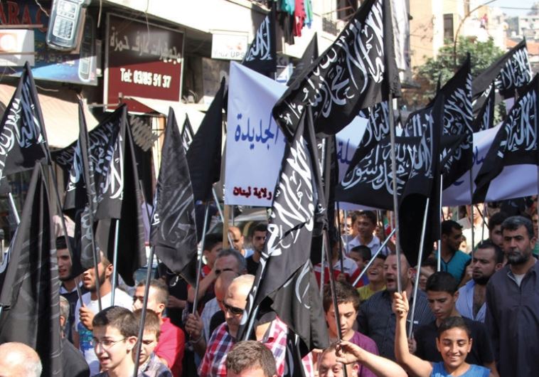 Members and supporters of the Islamist party Hizb Ut-Tahrir rally in Tripoli, northern Lebanon, in support of Palestinians and against Russian and US intervention in Syria, October 16