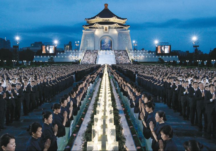 Buddhists pray at the Chiang Kai-shek Memorial Hall in Taipei