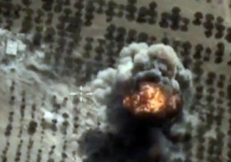 A video grab made on October 15, 2015, shows an image taken from a footage made available on the Russian Defence Ministry's official website, purporting to show an explosion after airstrikes carried out by Russian air force on what Russia says was an Islamic State facility in the Syrian province of 